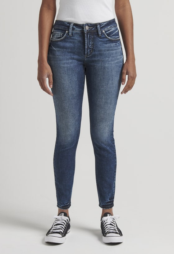 Women’s curvy relaxed fit slim bootcut jeans featuring a mid rise and dark indigo wash