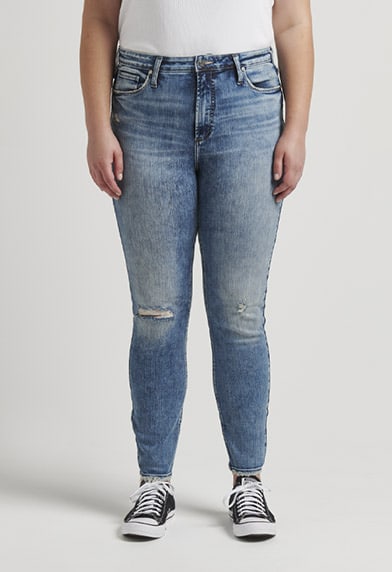 Plus size mid rise skinny jeans in white featuring a universally flattering fit