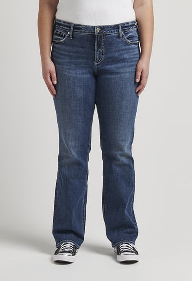 Plus size curvy relaxed fit slim bootcut jeans featuring a mid rise and medium indigo wash