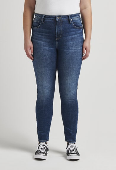 Plus size mid rise skinny jeans in white featuring a universally flattering fit