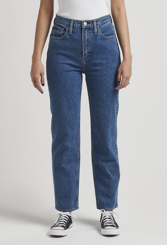 Women’s vintage fit straight leg jeans featuring a super high rise and light indigo wash