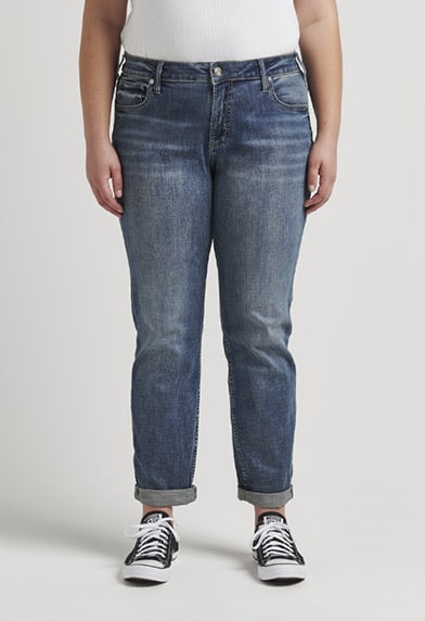 Plus size relaxed fit boyfriend jeans featuring a mid rise and dark indigo wash