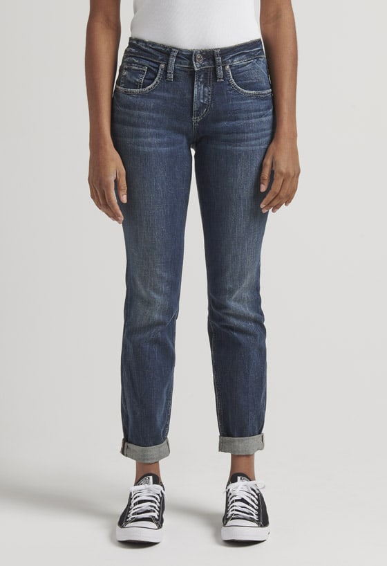 Women’s relaxed fit boyfriend jeans featuring a mid rise and dark indigo wash
